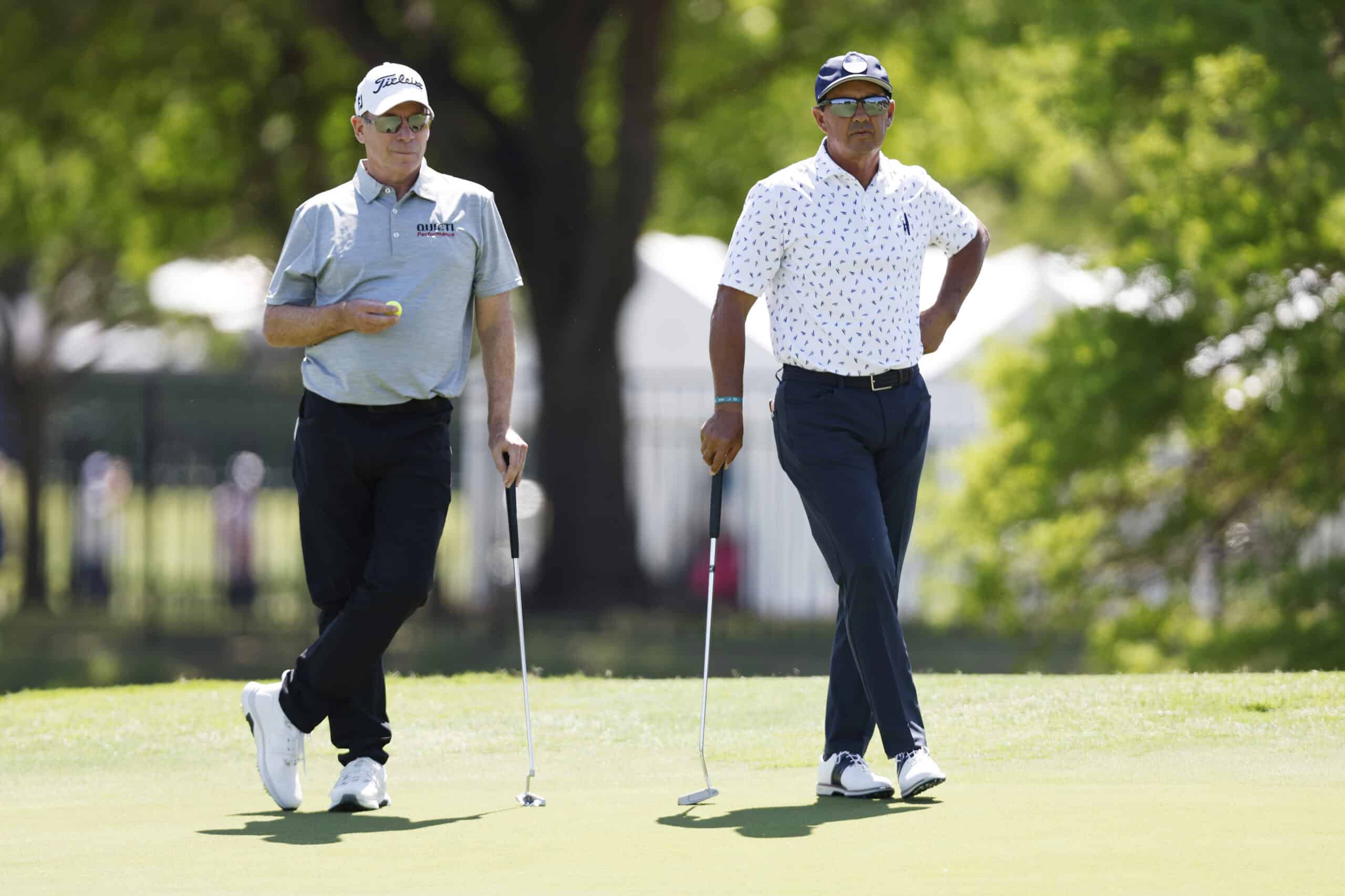 IRVING, TEXAS - APRIL 21: (L to R) John Huston of the United States and Tom Pernice Jr. of the United States watch a put on the 8th hole during the first round of the Invited Celebrity Classic at Las Colinas Country Club on April 21, 2023 in Irving, Texas. (Photo by Tim Heitman/Getty Images)